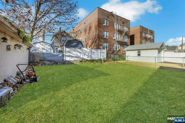 a view of a building next to a big yard