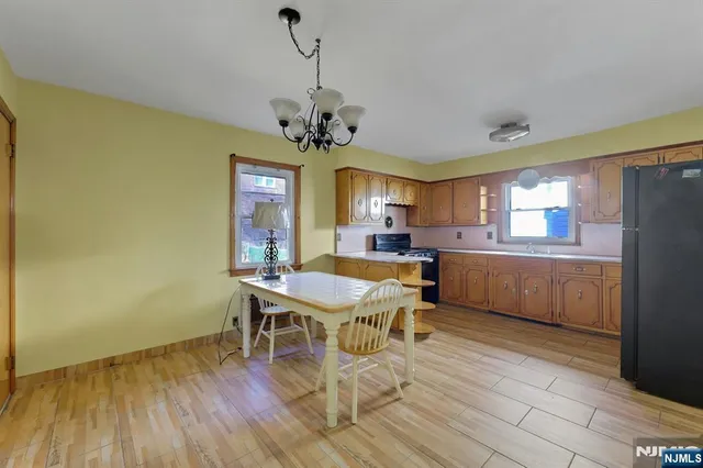 a view of a dining room with furniture and window
