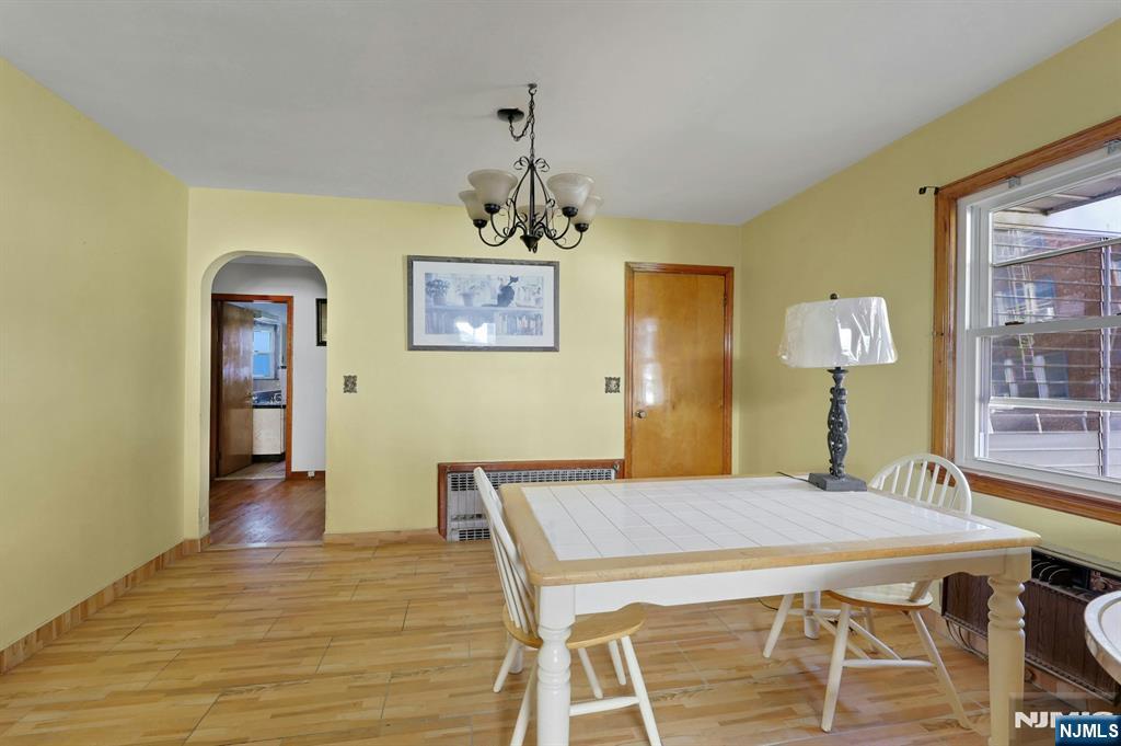 835 Chestnut Street Kearny, NJ 07032 - Photo 9 of 26 a view of a dining room with furniture and wooden floor