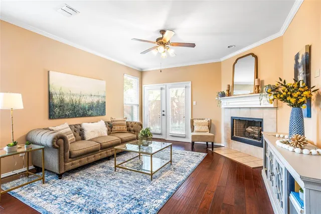 a living room with furniture fireplace and window