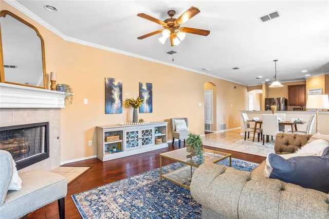 a living room with furniture and a fireplace