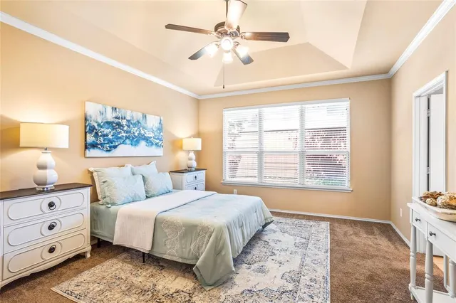 a bedroom with a large bed and a window