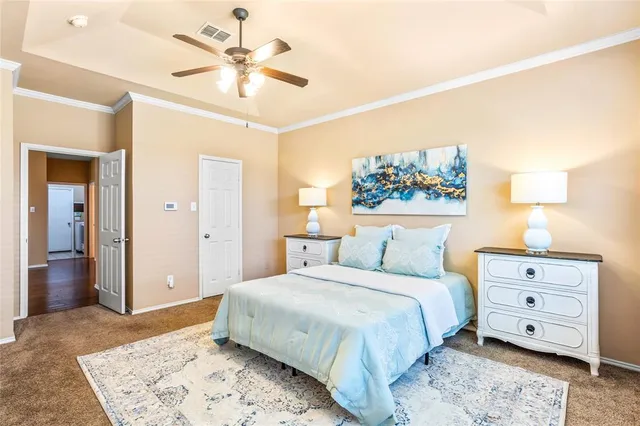 a bedroom with a bed and a dresser