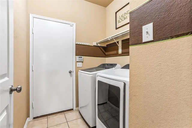 a view of washer and dryer in a utility room