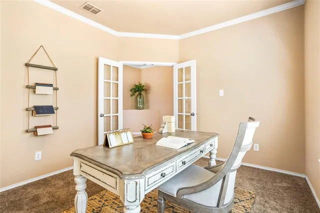 a dining room with a table and chairs
