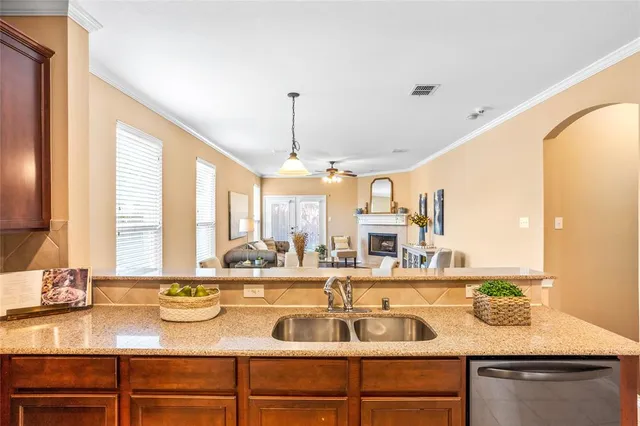 a kitchen with a sink and a large window