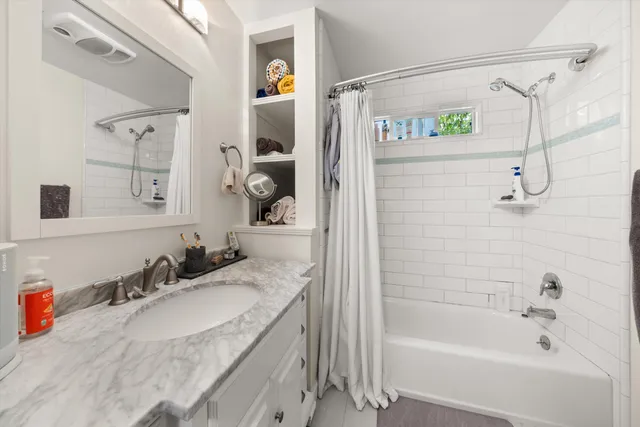 a view of a pathway with a tree