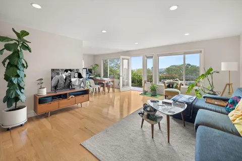 a living room with furniture and a table