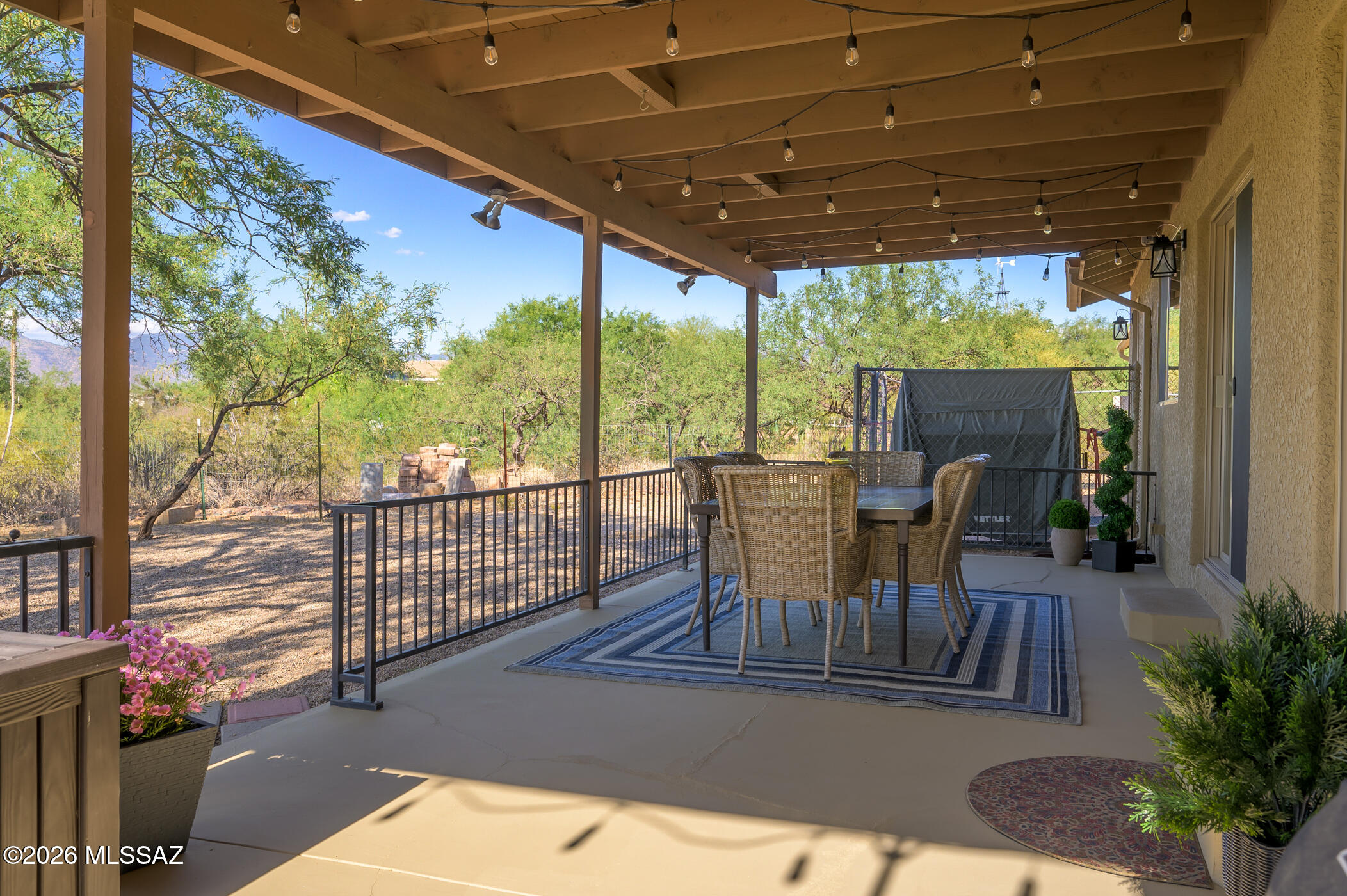 13599 East Rincon Ranch Road Vail, AZ 85641 - Photo 32 of 41 a view of a porch with furniture and backyard