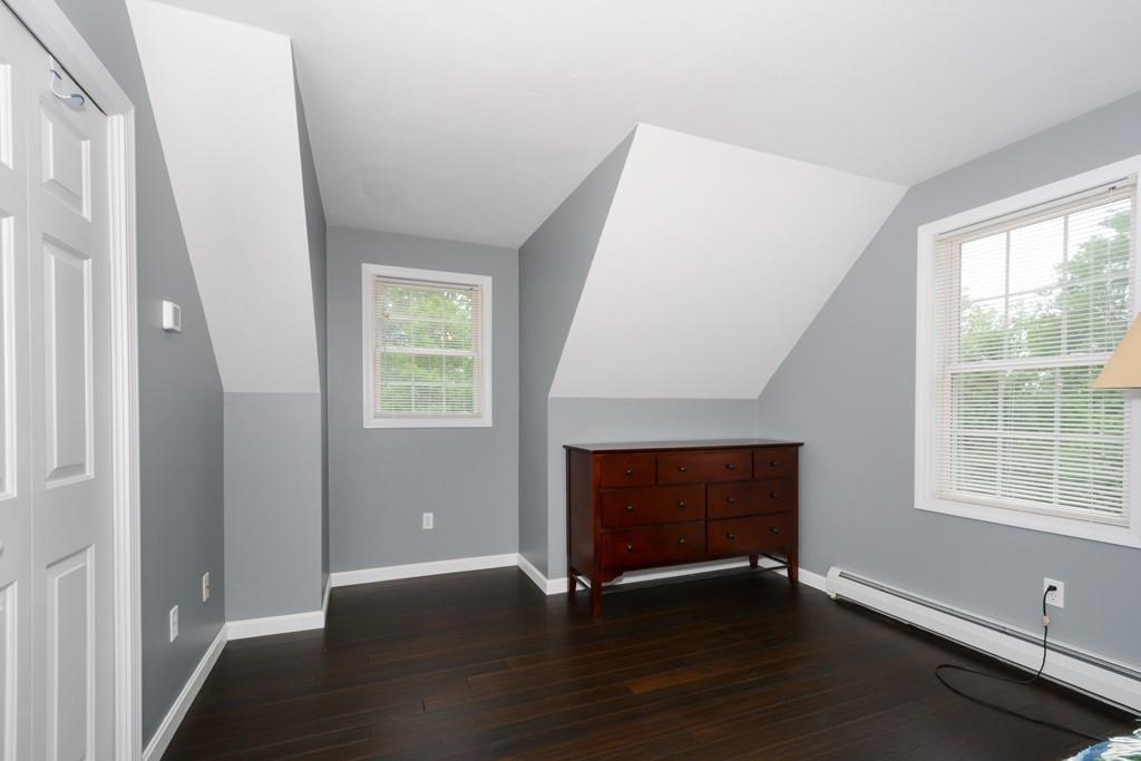431 Barr Road New Braintree, MA 01531 - Photo 19 of 29 a view of an empty room with wooden floor and a window