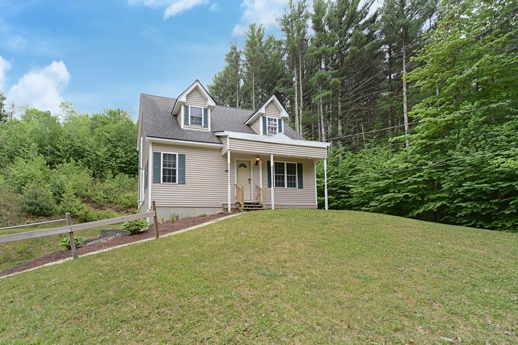 431 Barr Road New Braintree, MA 01531 - Photo 3 of 29 a front view of a house with a garden