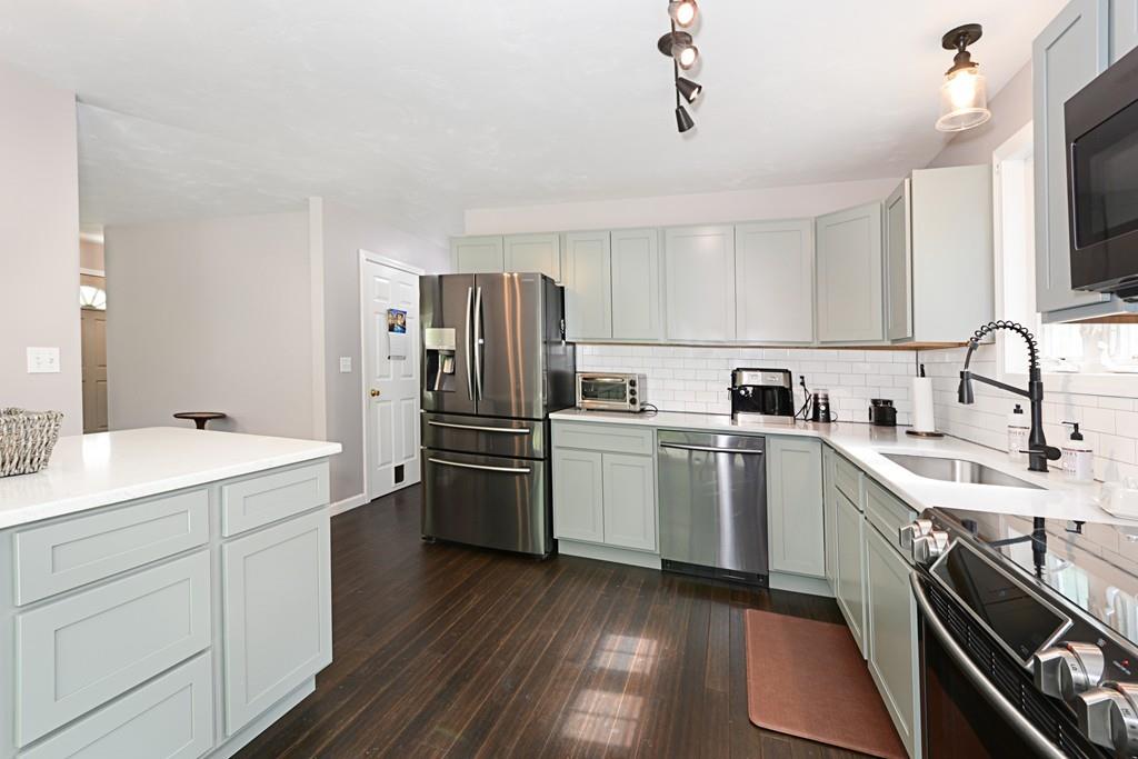431 Barr Road New Braintree, MA 01531 - Photo 5 of 29 a kitchen with a sink cabinets stainless steel appliances and a window