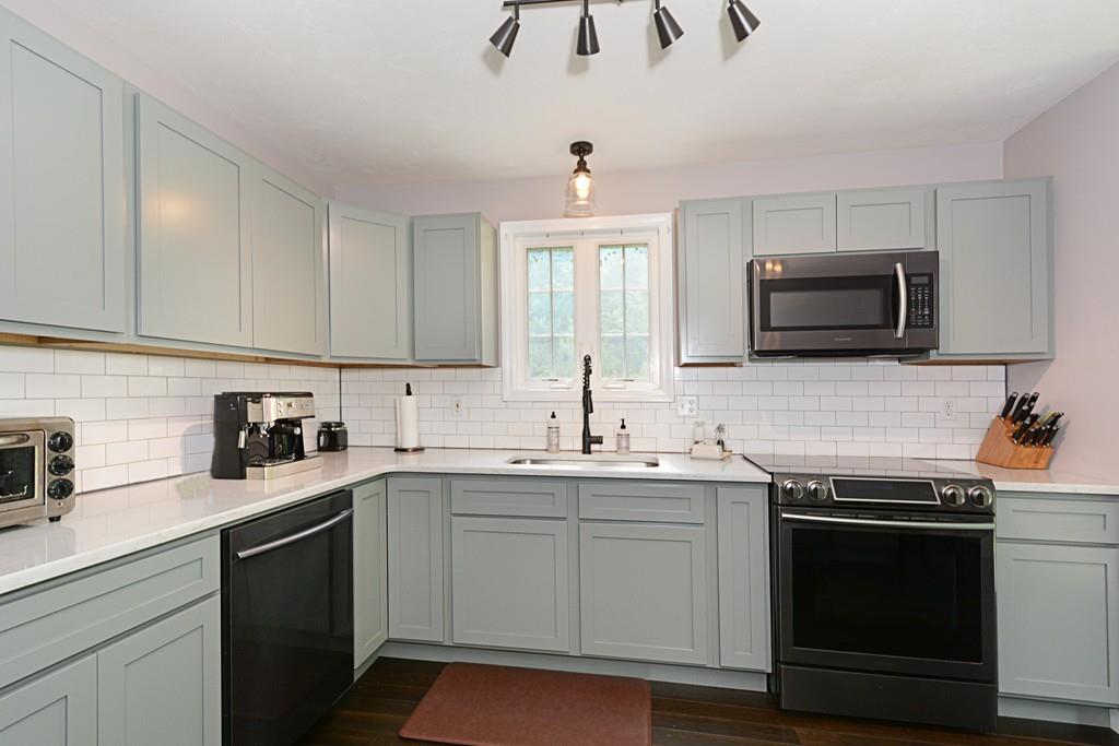 431 Barr Road New Braintree, MA 01531 - Photo 7 of 29 a kitchen with a sink stove and microwave