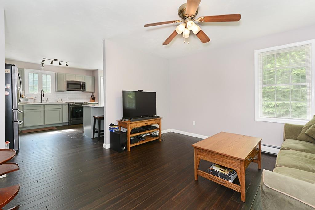 431 Barr Road New Braintree, MA 01531 - Photo 9 of 29 a living room with furniture flat screen tv and wooden floor