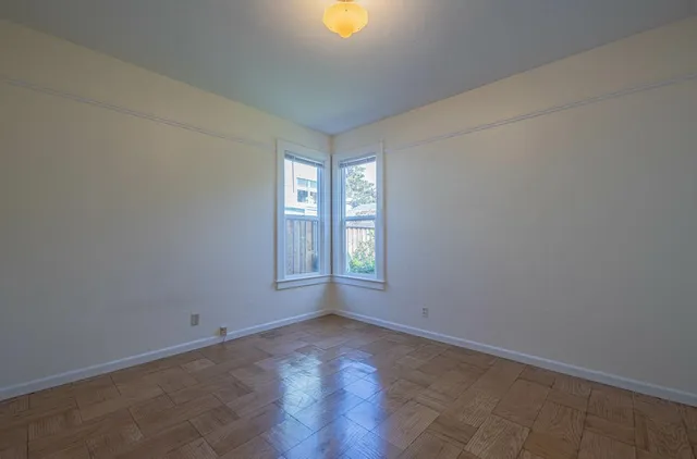 a view of an empty room with a window