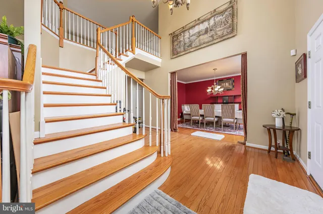 a view of entryway livingroom and hall with wooden floor