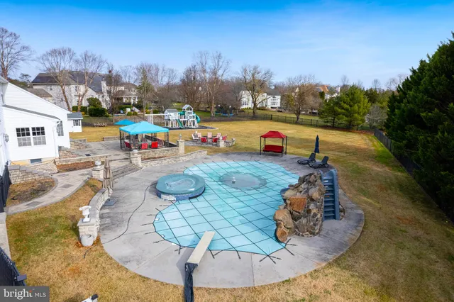 a view of a swimming pool with an outdoor seating