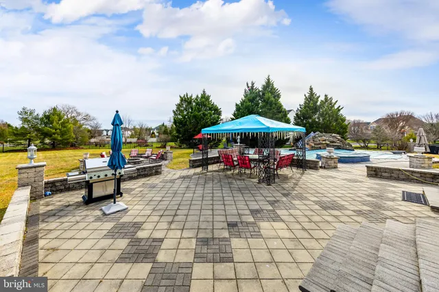 a view of a swimming pool and lounge chairs