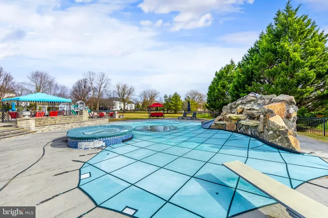 a outdoor space with lots of swings and slides