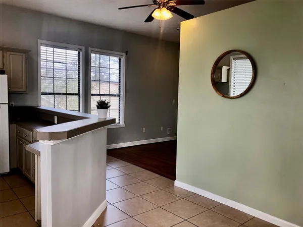 a kitchen with a stove a refrigerator and a sink