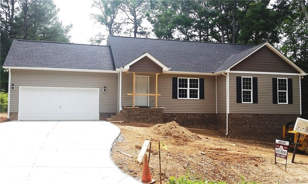 1815 Love Road Monroe, NC 28110 - Photo 1 of 9 a front view of a house with a yard