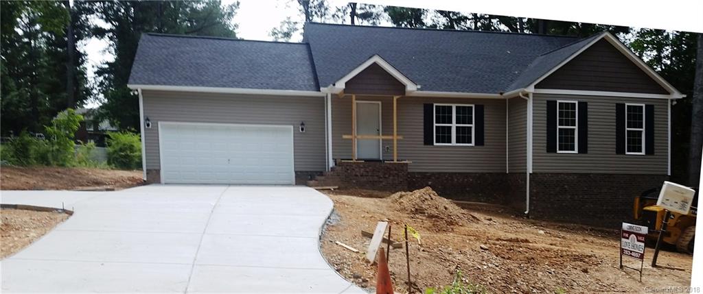 1815 Love Road Monroe, NC 28110 - Photo 4 of 9 a front view of a house with a yard