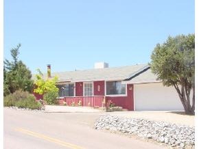 2660 Ridge Road, Unit 1 Prescott, AZ 86301 - Photo 1 of 1 a front view of a house with a yard and garage