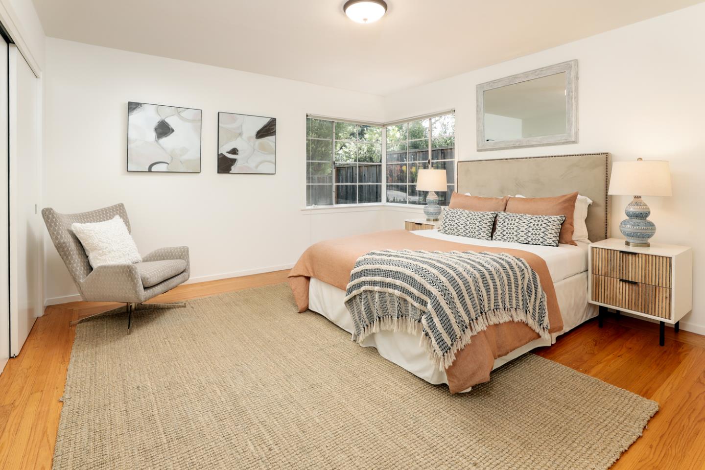 349 Chamisal Avenue Los Altos, CA 94022 - Photo 14 of 27 a bedroom with a bed and wooden floor