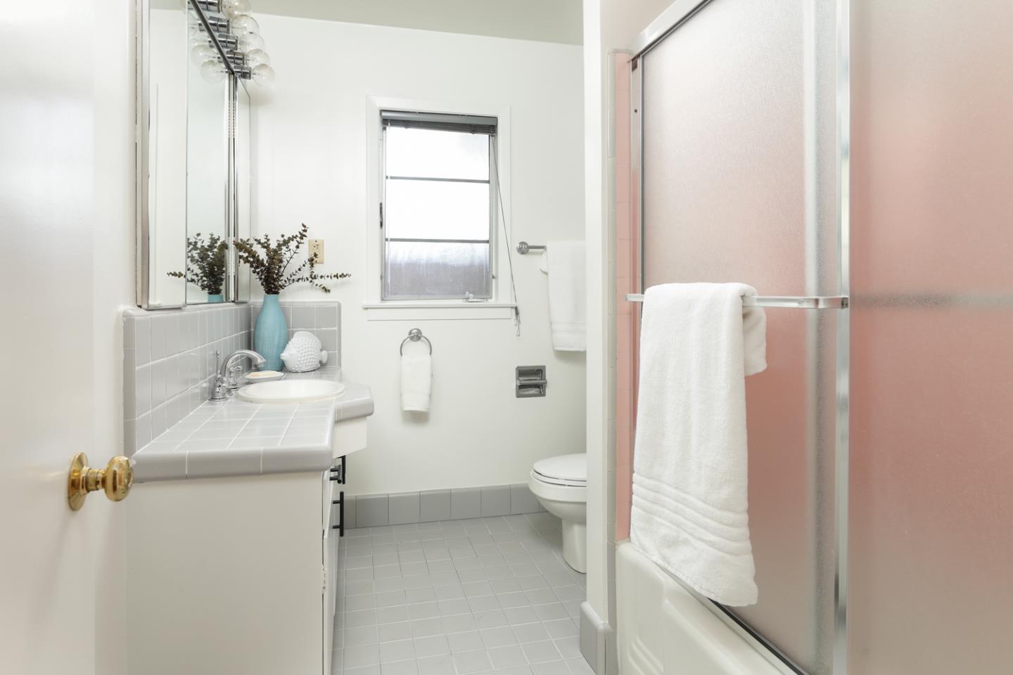 349 Chamisal Avenue Los Altos, CA 94022 - Photo 16 of 27 a bathroom with a sink toilet and shower