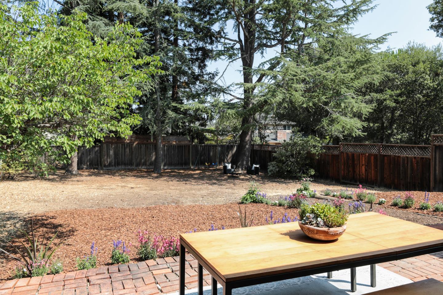 349 Chamisal Avenue Los Altos, CA 94022 - Photo 21 of 27 a view of a backyard with sitting area