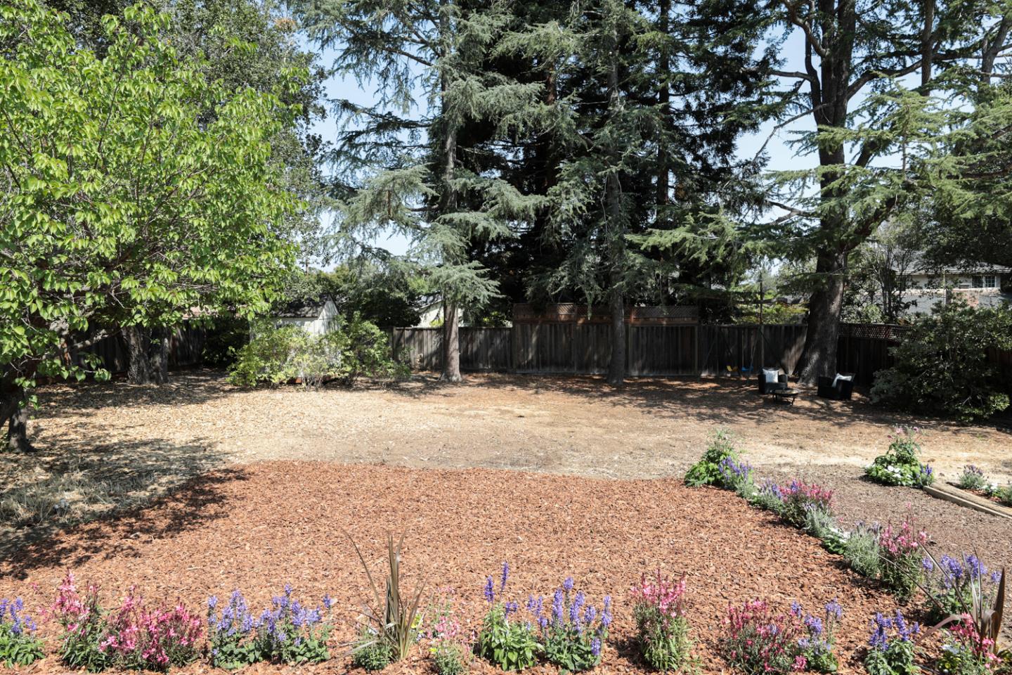 349 Chamisal Avenue Los Altos, CA 94022 - Photo 25 of 27 a backyard of a house with a tree