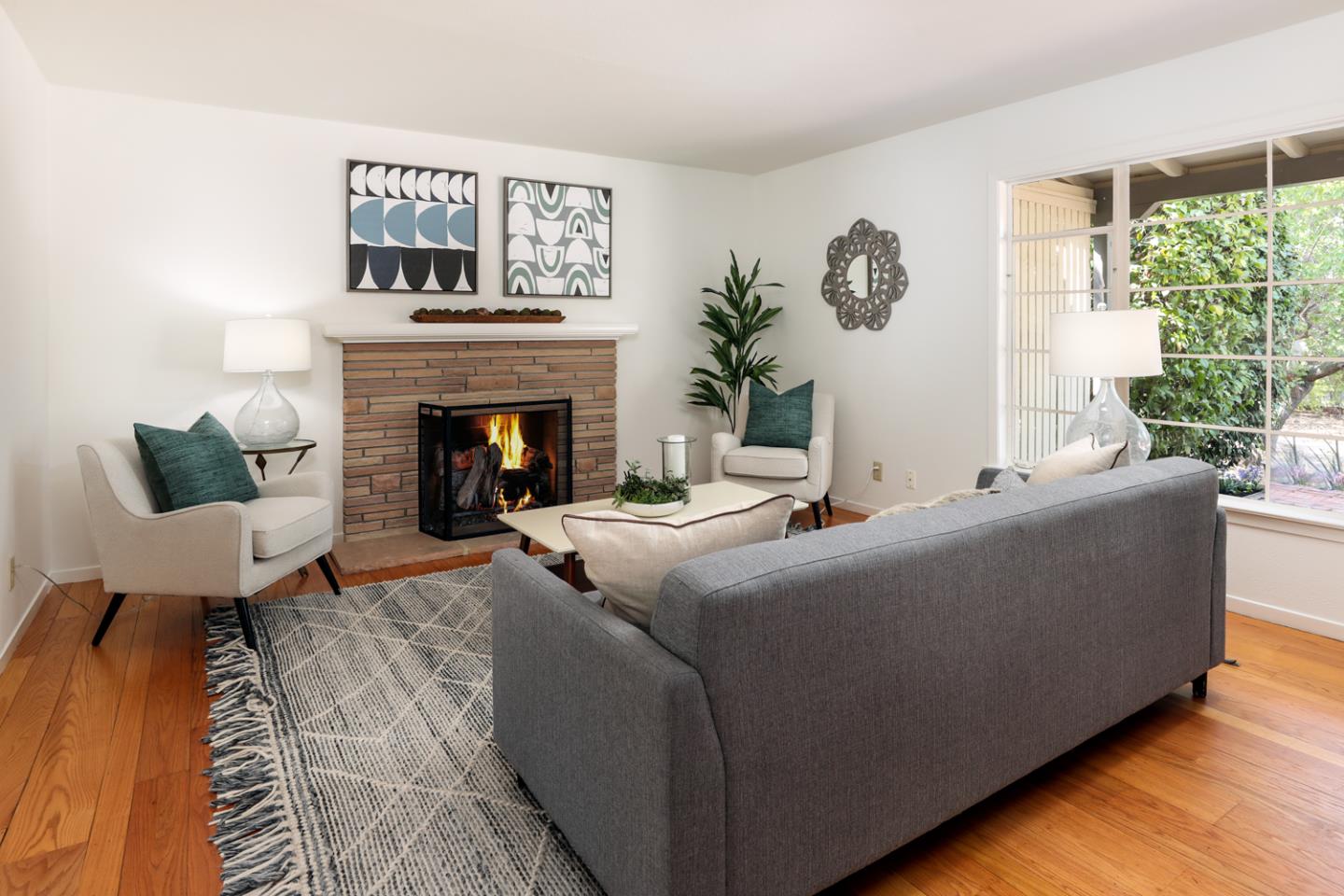 349 Chamisal Avenue Los Altos, CA 94022 - Photo 5 of 27 a living room with furniture and a fireplace