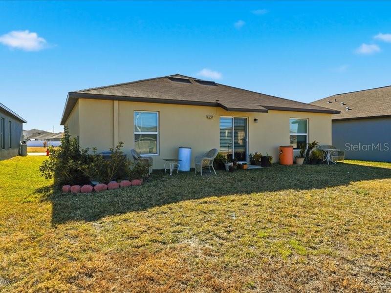 3943 Resting Robin Avenue Bartow, FL 33830 - Photo 30 of 38 a front view of a house with garden