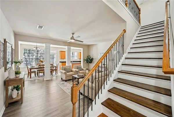 a view of entryway and hall with wooden floor