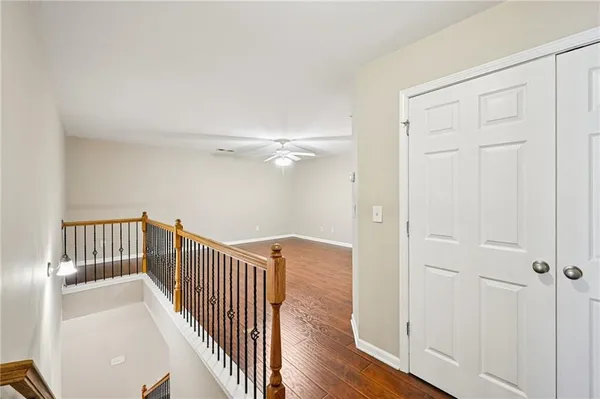 a view of hallway with wooden floor