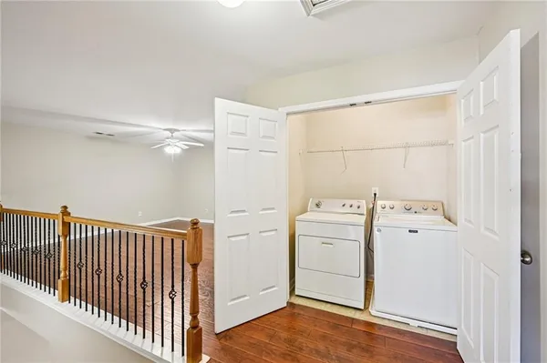 a view of a storage & utility room with dryer and washer