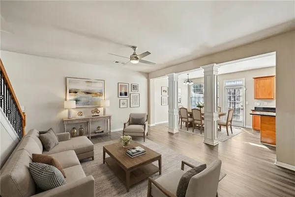 a living room with furniture and wooden floor