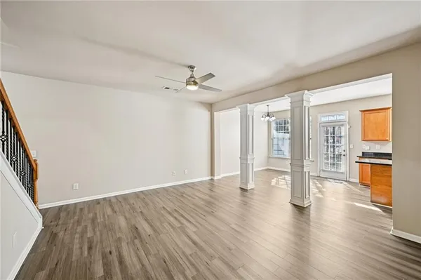 wooden floor in an empty room with a window