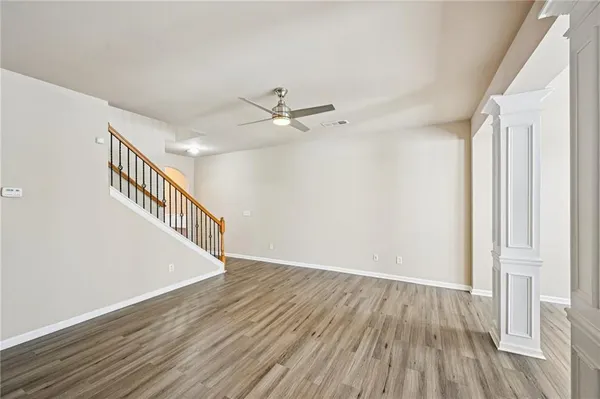 a view of an entryway with wooden floor