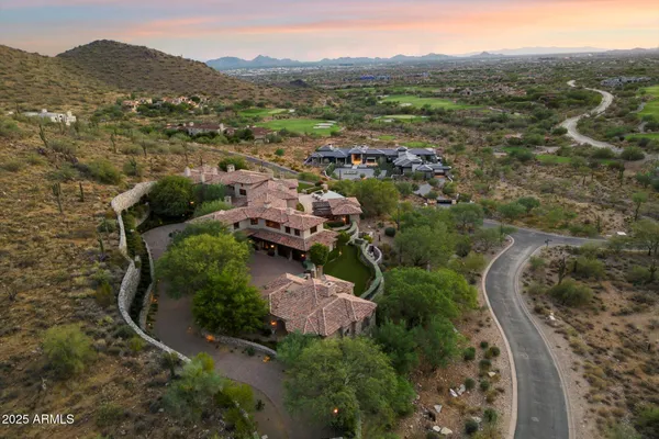 an aerial view of a house with a garden