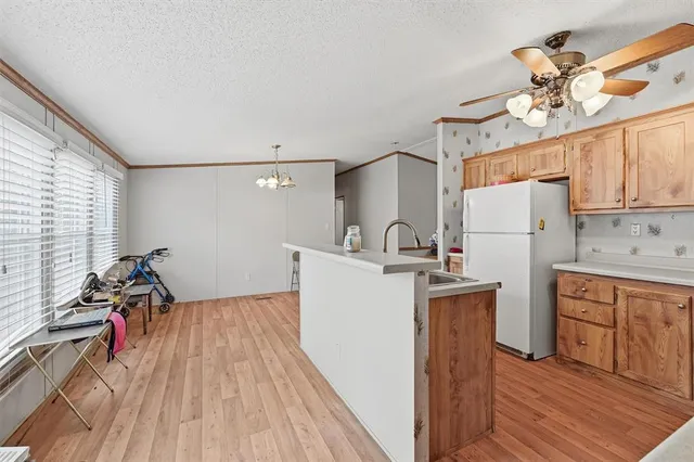 a kitchen with a sink a stove and refrigerator