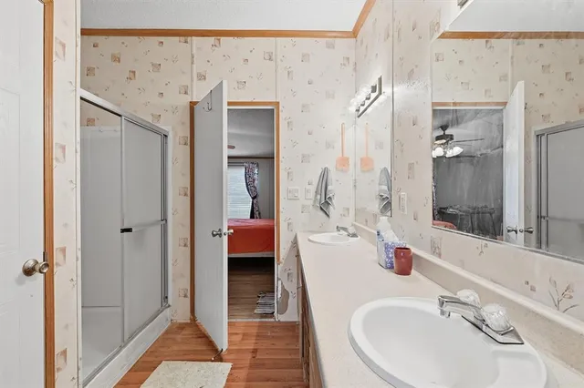 a bathroom with a sink a vanity and a mirror