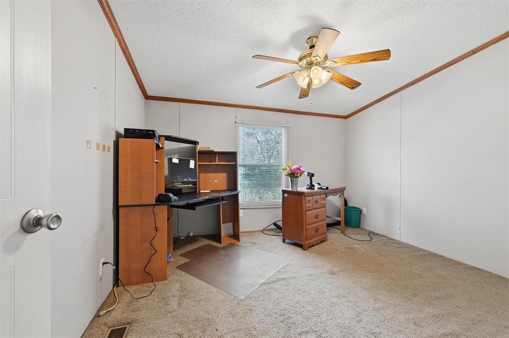 227 Sheryl Lane Denison, TX 75021 - Photo 22 of 37 a workspace with furniture and ceiling fan