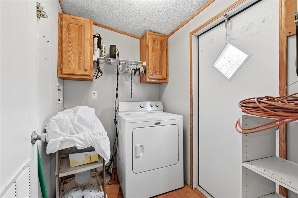 227 Sheryl Lane Denison, TX 75021 - Photo 26 of 37 a utility room with dryer and washer