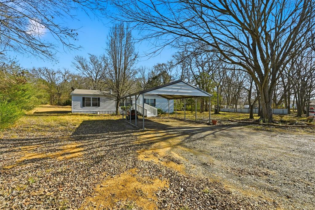 227 Sheryl Lane Denison, TX 75021 - Photo 4 of 37 a view of a house with a yard
