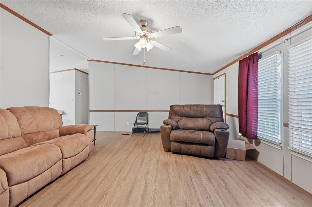 227 Sheryl Lane Denison, TX 75021 - Photo 10 of 37 a living room with furniture and a large window