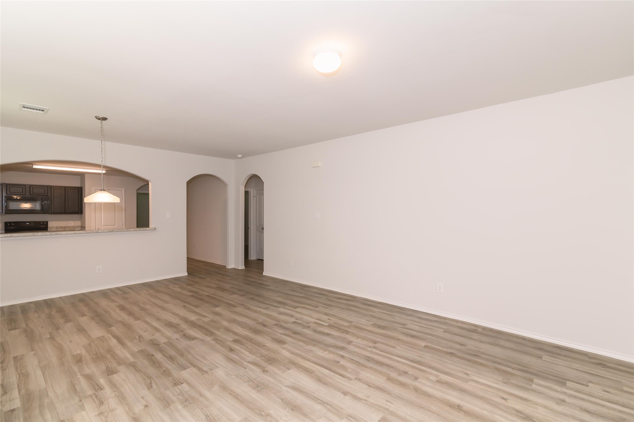 8715 Lar Ree Oaks Circle Houston, TX 77028 - Photo 2 of 7 a view of a livingroom with wooden floor