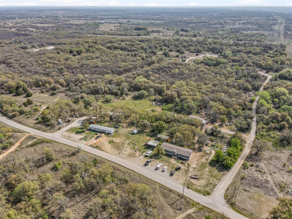 0 County Road 3855 Poolville, TX 76487 - Photo 11 of 21 an aerial view of residential houses with outdoor space