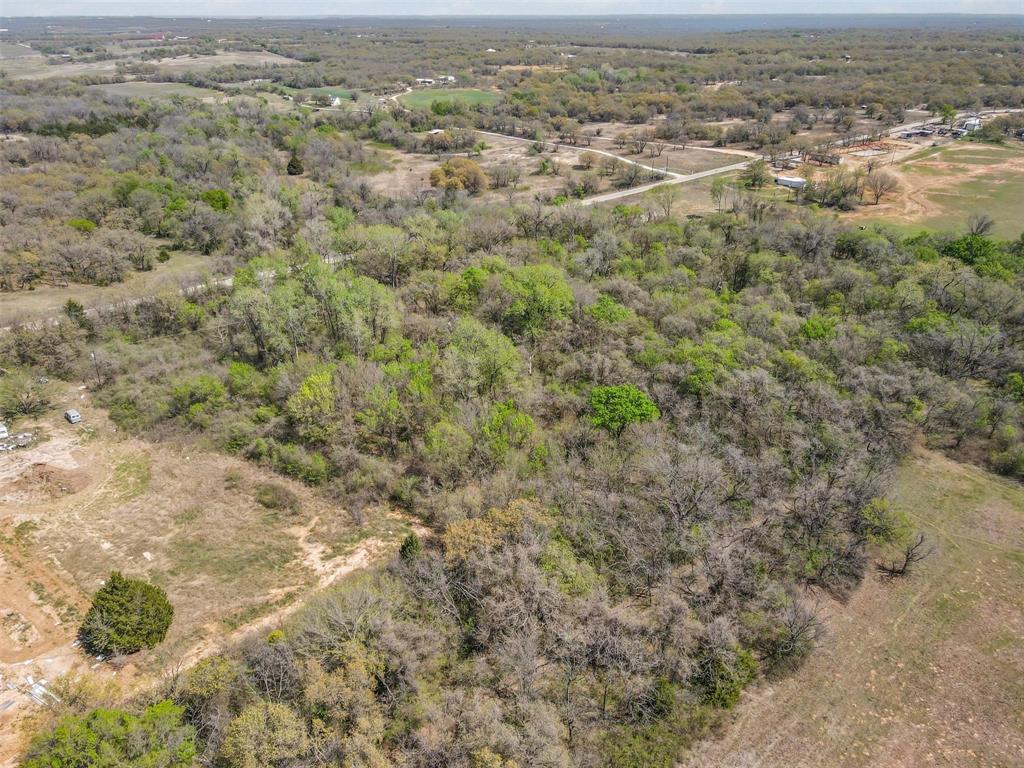 0 County Road 3855 Poolville, TX 76487 - Photo 4 of 21 an aerial view of residential houses with outdoor space