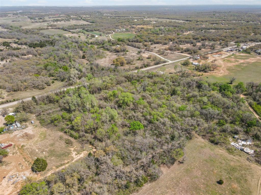 0 County Road 3855 Poolville, TX 76487 - Photo 5 of 21 an aerial view of residential houses with outdoor space